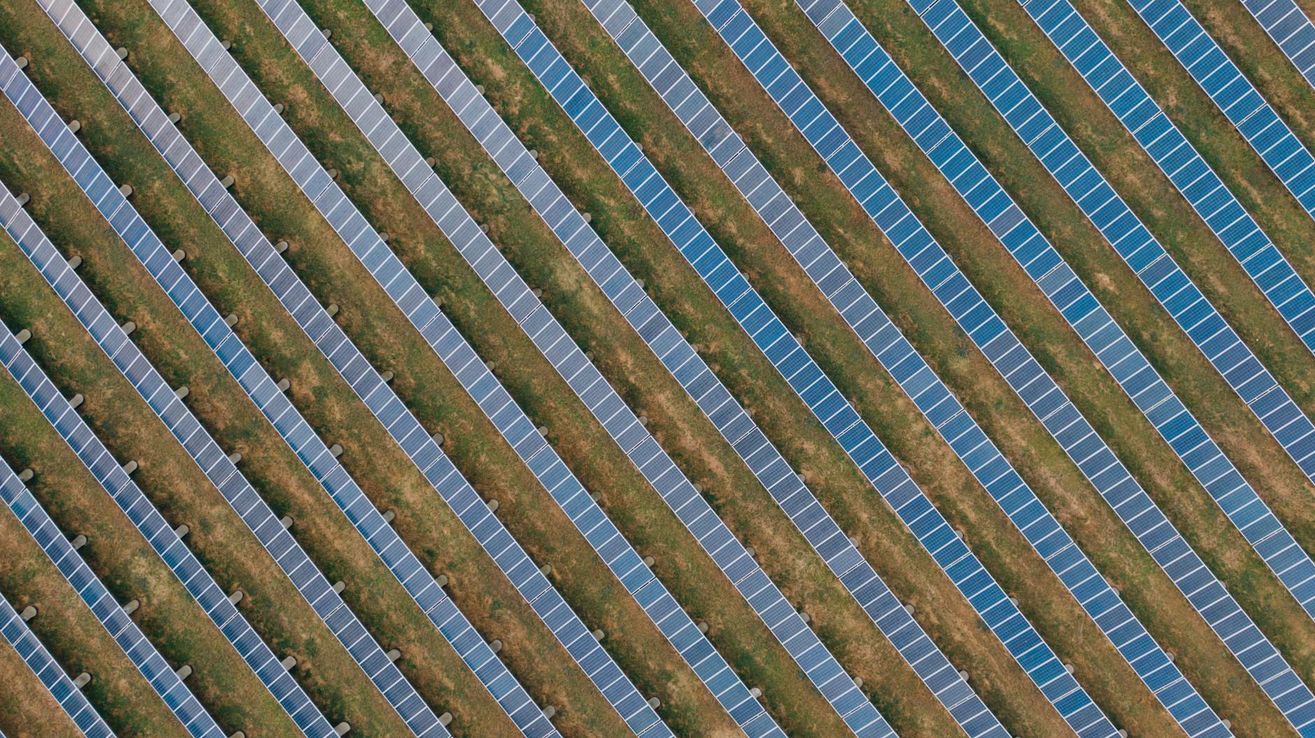 textured background of solar panels in countryside field